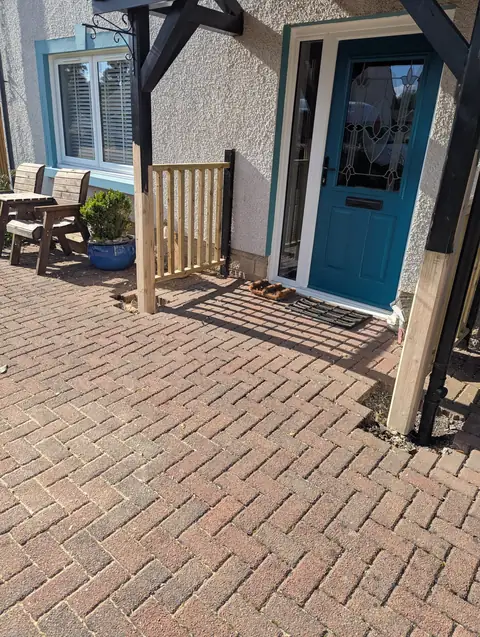 New timber balustrade fitted between the repaired canopy leg and the house wall in Irvine