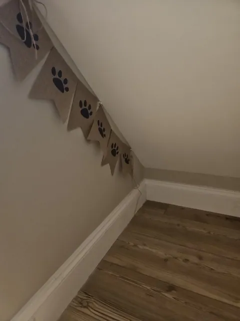 The finished understairs space, plastered and decorated with skirting cut to follow the rake of the stairs