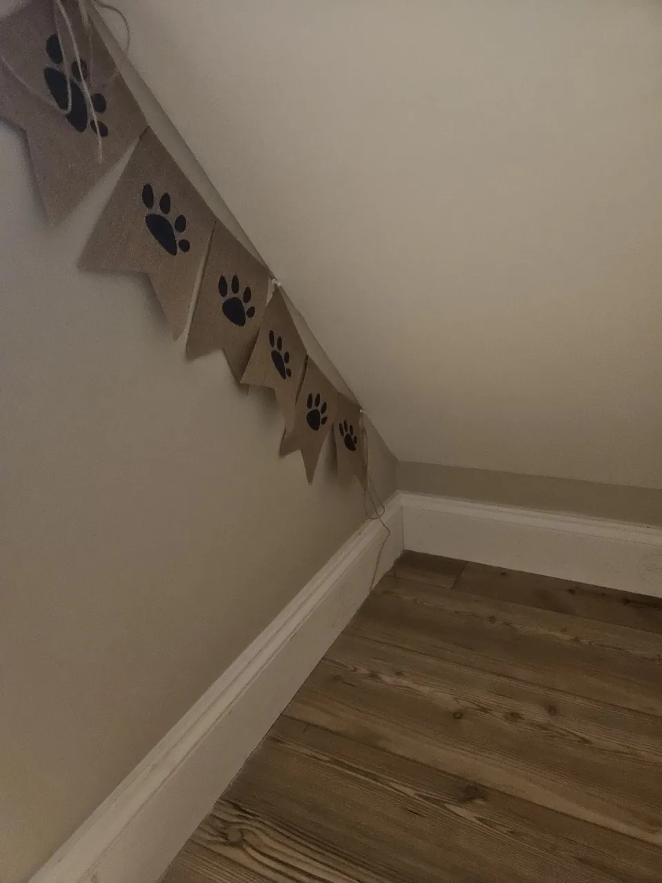 The finished understairs space, plastered and decorated with skirting cut to follow the rake of the stairs