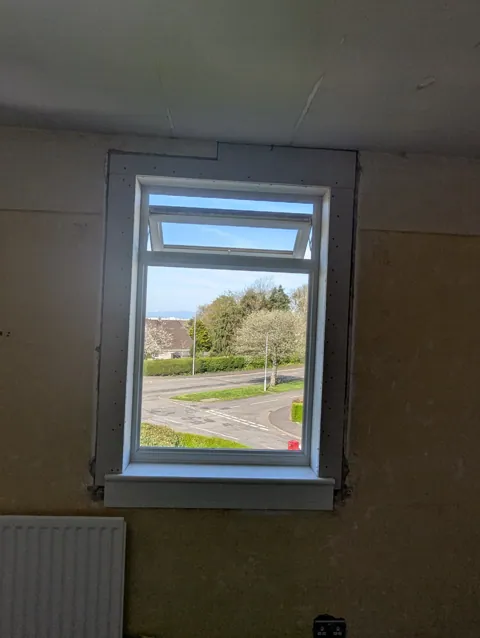 New window sill and facings fitted around a window opening in Dundonald