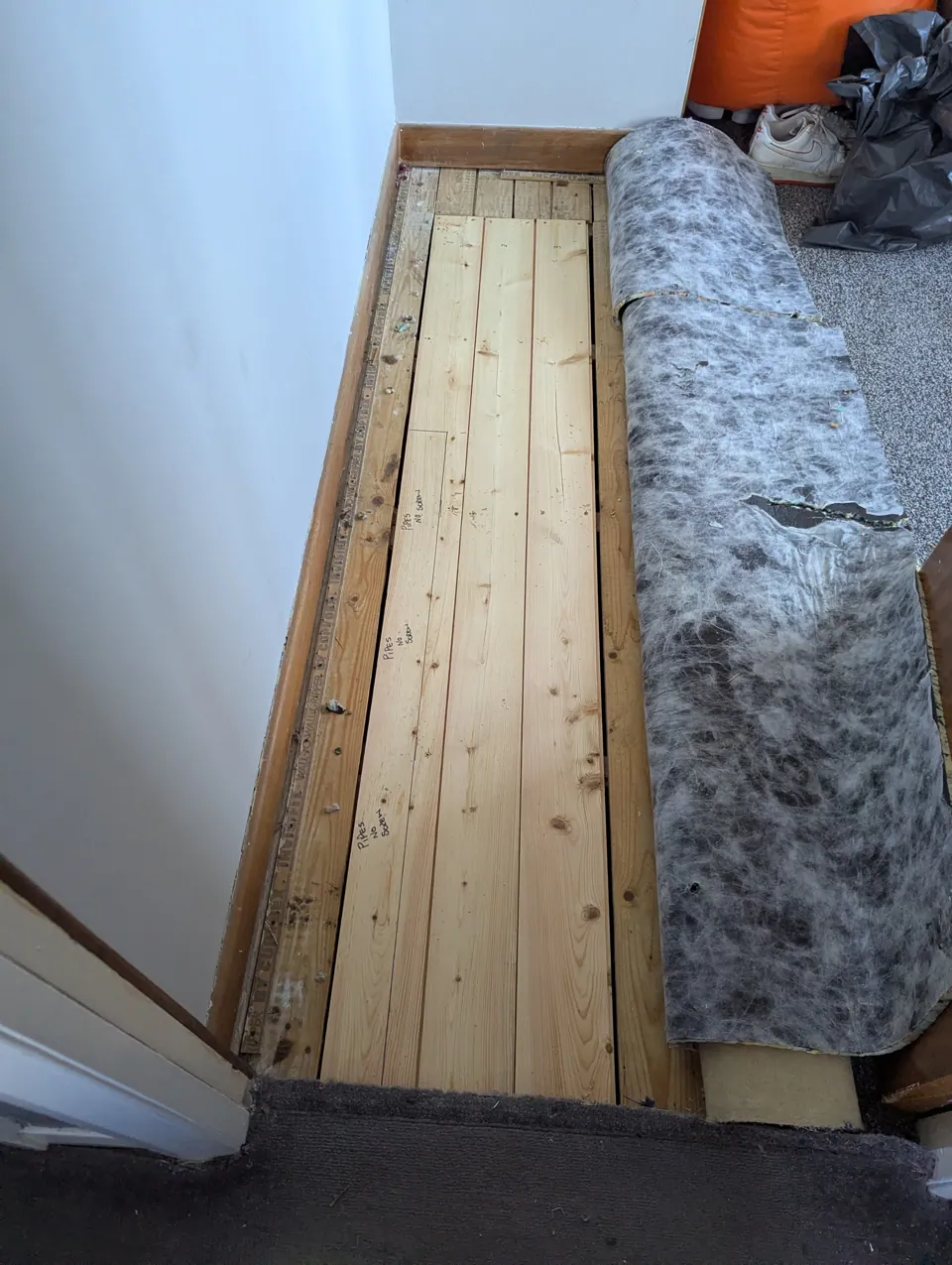 Carpet and underlay lifted back to reach the affected area of floor
