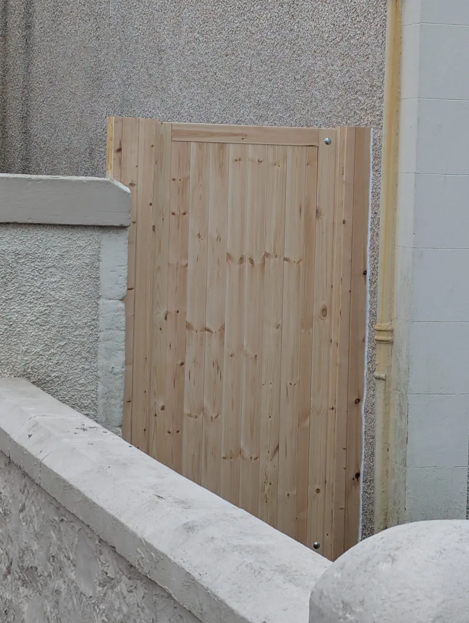 A second ledged and braced timber gate built and fitted between walls at another property in Saltcoats