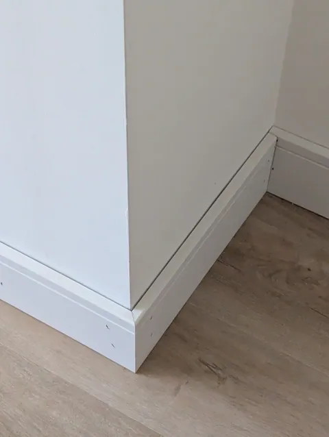Mitred external corner on new white skirting board fitted in Irvine