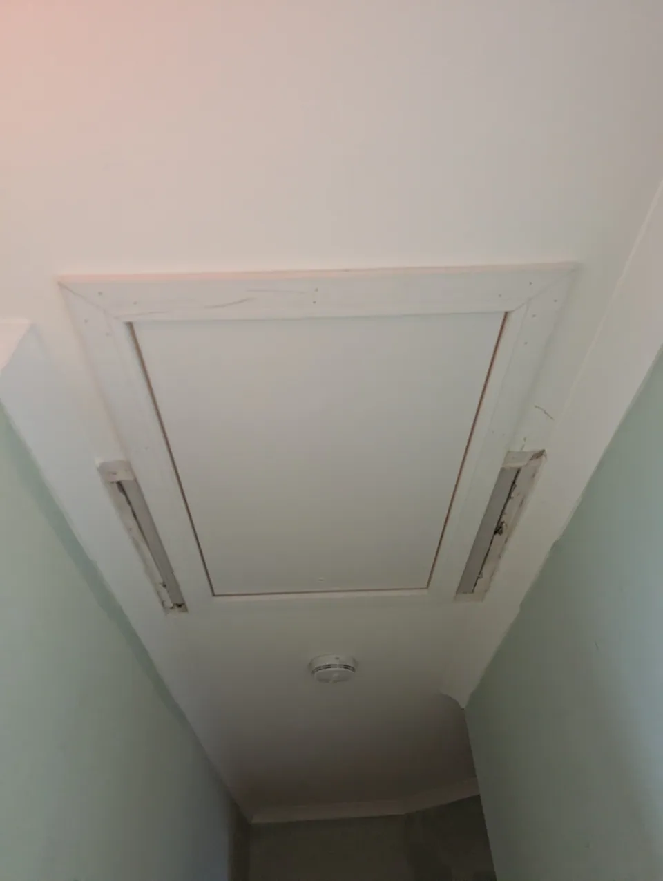 New loft hatch fitted flush and square to the hallway ceiling with facing run around the opening
