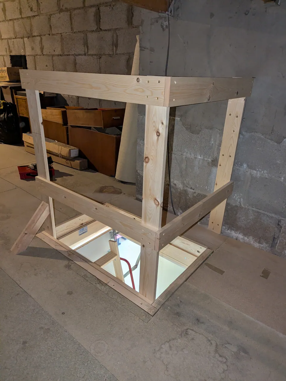 Purpose-built timber safety guard rail constructed around the loft opening inside the loft