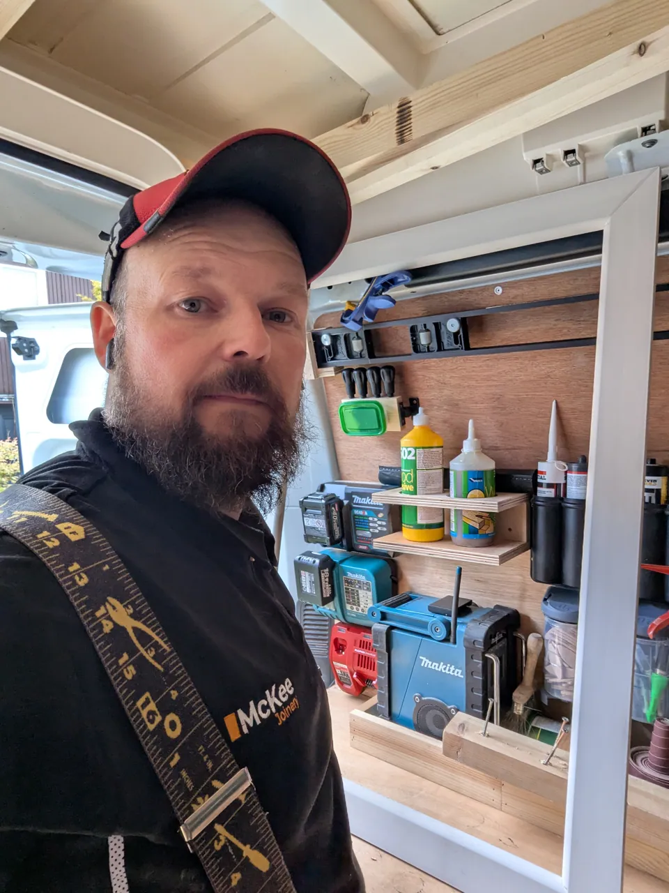 Tom McKee in the van with the architrave facing made up ready to fit around the loft hatch