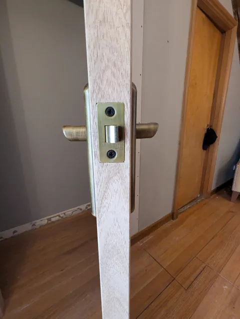 Hinge fitted between the oak door and the solid oak frame in Lugton