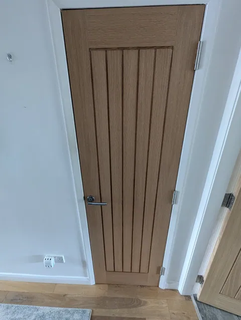 Narrow Deanta Ely oak door fitted to a small opening in Prestwick